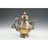 A TIBETAN BRASS AND SILVER MOUNTED EWER AND COVER, 19th century, the domed cover with pointed finial
