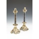 A PAIR OF 19TH CENTURY BRASS SPRING LOADED CANDLESTICKS, with cloisonné columns