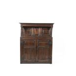 A PANELLED FRONT COURT CUPBOARD with recessed top, the base with two panelled doors, iron