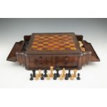 AN EDWARDIAN WALNUT MARQUETRY TABLE-TOP CHESS BOARD, the chequered top flanked by twin storage