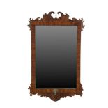 A GEORGE I STYLE WALNUT FRAME WALL MIRROR, of upright rectangular form, with carved scroll frames,