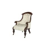 A WILLIAM IV MAHOGANY FRAMED UPHOLSTERED ARMCHAIR with curved exposed frame, the button back and