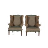 A PAIR OF GEORGE III STYLE WING BACK ARMCHAIRS, raised on square tapering legs. (2)