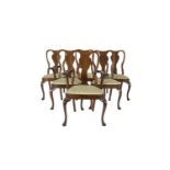A SET OF SIX QUEEN ANNE STYLE WALNUT DINING CHAIRS, comprising two carvers and four single chairs,