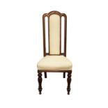 AN IRISH MAHOGANY AND UPHOLSTERED SIDE CHAIR, stamped 'Strahan of Dublin', the arched padded back