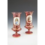 A PAIR OF VICTORIAN BOHEMIAN RUBY OVERLAID GLASS VASES, each with shaped serrated rim, the body