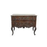 A 19TH CENTURY FRENCH PROVINCIAL FRUITWOOD SERPENTINE FRONT COMMODE, the moulded top above twin