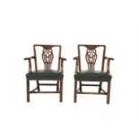 A PAIR OF 19TH CENTURY MAHOGANY FRAMED ELBOW CHAIRS IN THE GEORGIAN TASTE, the flat crest rail above