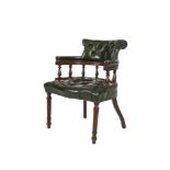 A MAHOGANY FRAMED OFFICE ARMCHAIR, the raised back, armrests and bowfront seat buttoned and