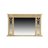 A RECTANGULAR PARCEL GILT COMPARTMENTED OVERMANTLE MIRROR with moulded cornice above reeded frieze
