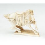 A JAPANESE CARVED IVORY MODEL OF A STARTLED HORSE, 19th century, standing on three legs, signed. 7cm