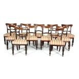 A SET OF ELEVEN VICTORIAN MAHOGANY FRAMED COMPRESSED BALLOON BACK DINING CHAIRS, with incised line