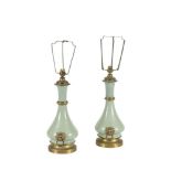 A PAIR OF CELADON PORCELAIN TABLE LAMPS, of circular baluster form with applied brass mounts, and