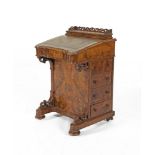 A VICTORIAN WALNUT DAVENPORT DESK, the inlaid top surmounted with low pierced three quarter gallery,