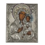 A RUSSIAN SILVERED OVERLAY AND CHAMPLEVE ENAMEL ICON, 20th century, depicting the Madonna and Child,