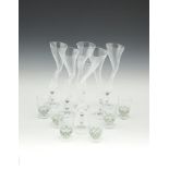 A SET OF SIX FRENCH CLEAR GLASS POSY VASES, Post War, each moulded in irregular form, marked to