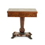 A VICTORIAN KILLARNEY WORK INLAID ARBUTUS AND YEWWOOD FOLDING TOP GAMES TABLE, the top centred