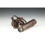A LATE 19TH CENTURY PORTABLE TELESCOPE, fitted within a brown leather case. 30cm closed, 83cm
