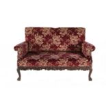 AN UPHOLSTERED MAHOGANY FRAMED TWO SEAT SETTEE, the upholstered rectangular panel back and seat