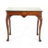 A GEORGIAN MAHOGANY COMPOSED WRITING TABLE, the lift top with moulded rim opening to reveal an