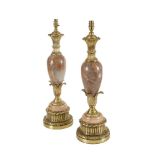 A PAIR OF BRASS AND RED ALABASTER COLUMN TABLE LAMPS, the baluster column of ovoid form supported on