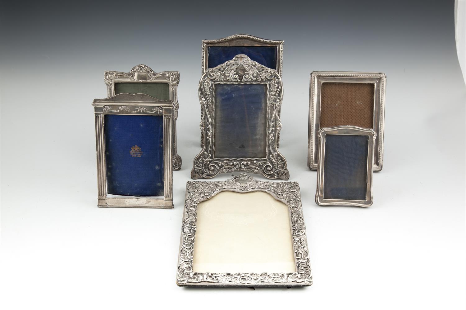 A COLLECTION OF SEVEN SILVER PHOTO FRAMES