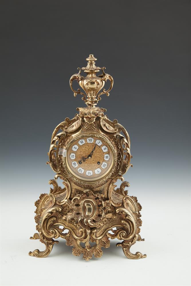 A FRENCH CAST BRASS MANTLE CLOCK, 20th century, surmounted by an urn over a gilt metal and enamel