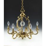 A BRASS FRAMED SIX LIGHT ELECTROLIER, in the French 19th century style, with leaf cast corona