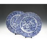 A PAIR OF JAPANESE BLUE AND WHITE CHARGERS, 20th century, each of circular form with wavy rim,