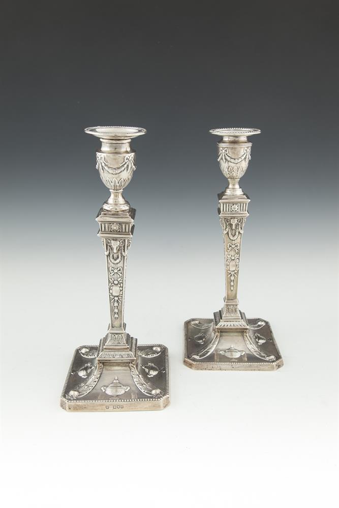 A MATCHED PAIR OF 19TH CENTURY NEO-CLASSICAL TABLE CANDLESTICKS, of squared tapering form, Sheffield
