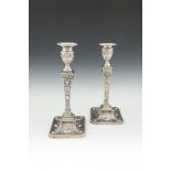 A MATCHED PAIR OF 19TH CENTURY NEO-CLASSICAL TABLE CANDLESTICKS, of squared tapering form, Sheffield