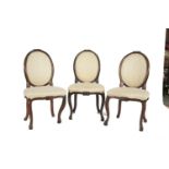 A SET OF THREE 19TH CENTURY FRENCH FRUITWOOD FRAMED SIDE CHAIRS, with oval upholstered backs