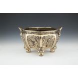A CHINESE CAST BRASS TWO HANDLE JARDINIERE, of octagonal form, the narrow rim with Greek key border,