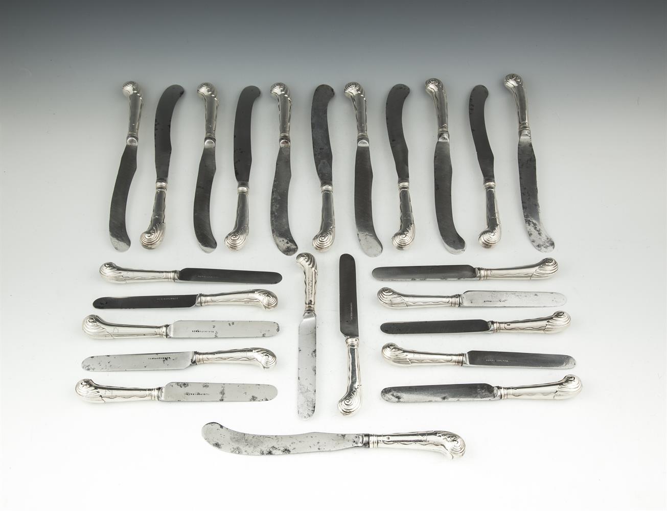 A COMPOSED SET OF TWELVE GEORGIAN SILVER PISTOL HANDLED TABLE KNIVES, English and Irish makers, no