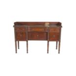 A LATE 19TH CENTURY MAHOGANY SHAPED RECTANGULAR SIDE BOARD, with raised panel back and sides above