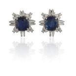 A PAIR OF SAPPHIRE AND DIAMOND CLUSTER EARRINGSThe cushion-shaped sapphires weighing 2.79 & 2.39cts,