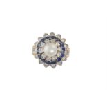 A CULTURED PEARL, DIAMOND AND SAPPHIRE RINGThe 7.10mm round-shaped cultured pearl, within borders of