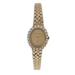 A LADY'S GOLD AND DIAMOND WRISTWATCH, BY BUECHE-GIRODThe watch with oval signed gold dial and