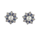 A PAIR OF CULTURED PEARL, DIAMOND AND SAPPHIRE EARCLIPS/BROOCHESEach designed as a flower head,