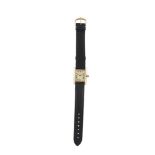 A LADY'S GOLD PLATED TANK QUARTZ WRISTWATCH, BY CARTIERThe rectangular cream signed dial with