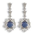 A PAIR OF SAPPHIRE AND DIAMOND PENDANT EARRINGSEach flowerhead centrally-set with an oval cabochon