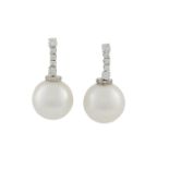 A PAIR OF CULTURED PEARL AND DIAMOND EAR PENDENTSEach composed of a single line of round brilliant-