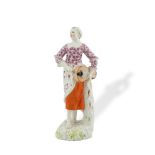 AN 18TH CENTURY GERMAN HOCSHT PORCELAIN FIGURE, modelled as a peasant girl holding a hurdy gurdy,