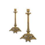 A PAIR OF 19TH CENTURY FRENCH ORMOLU CANDLESTICKS, with cast leaf decoration, reeded columns and