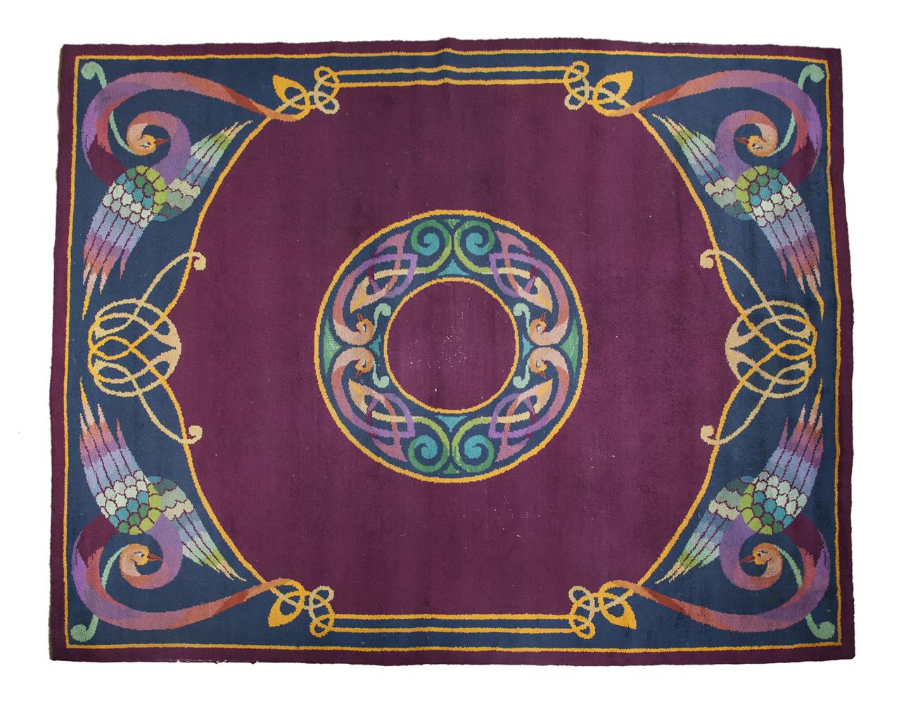 A LARGE DUN EMER WOOL CARPET, the puice ground with central medallion with Celtic pattern, each