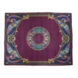 A LARGE DUN EMER WOOL CARPET, the puice ground with central medallion with Celtic pattern, each
