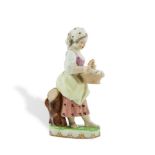 AN 18TH/19TH CENTURY AUSTRIAN PORCELAIN FIGURE, Vienna, modelled as a young girl holding a wicker