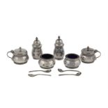 A CASED SET OF SIX SILVER CELTIC PATTERN BALUSTER CONDIMENTS, Birmingham 1947, comprising a pair