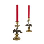 A PAIR OF EARLY 19TH CENTURY FRENCH BRONZE AND CAST ORMOLU CANDLESTICKS, the urn sconces and leaf