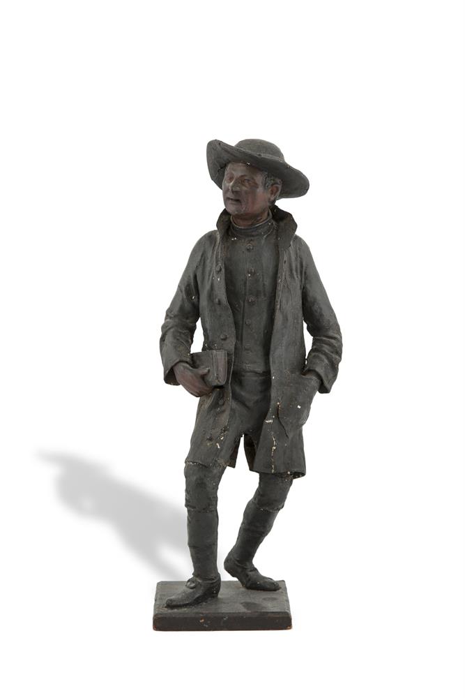 A 19TH CENTURY AMERICAN PAPIER MACHE FIGURE OF A PILGRIM, in stride and carrying a book in his right